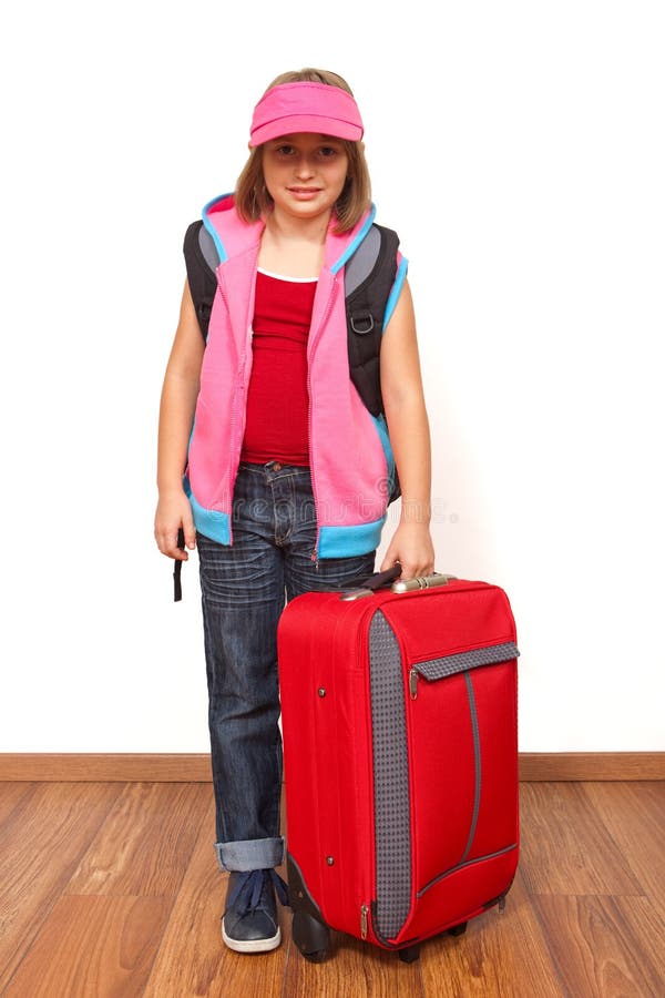 Little girl ready to travel with big red luggage. Little girl ready to travel with big red luggage