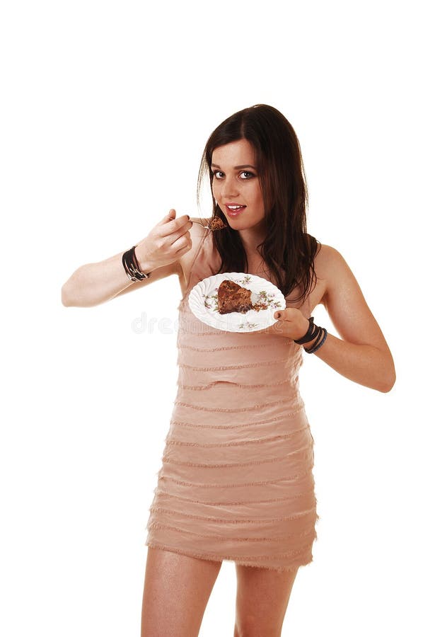 Menina que come o bolo. imagem de stock royalty free Menina que come o bolo. imagem de stock royalty free