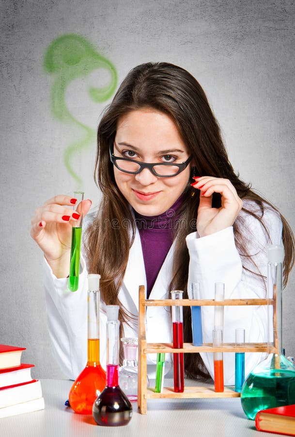 Girl experimenting with colorful chemical liquids. Girl experimenting with colorful chemical liquids