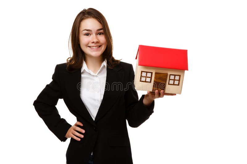 Rapariga a segurar uma maquete de casa fotografia de stock