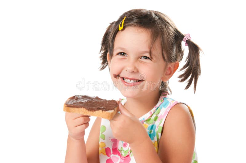 Menina que morde um petisco imagens de stock Menina que morde um petisco imagens de stock