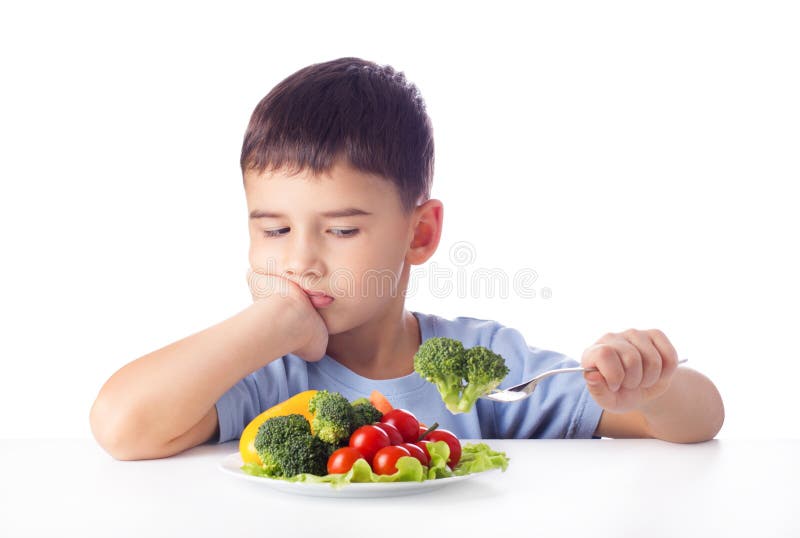 Sad boy doesn't want eat healthy vegetables. Sad boy doesn't want eat healthy vegetables