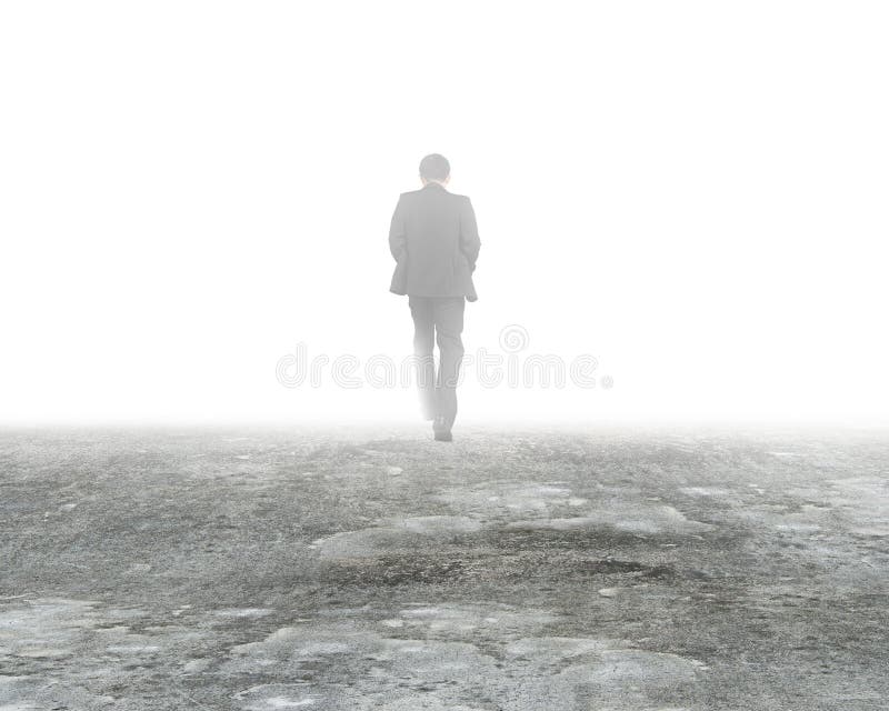 Man walking in mystery fog on dirty concrete floor. Man walking in mystery fog on dirty concrete floor