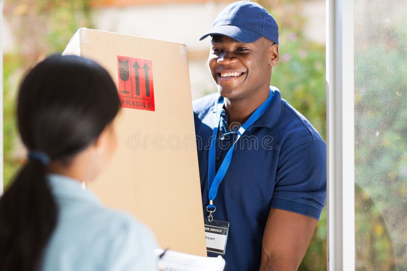 Friendly young african american delivery men delivering a package. Friendly young african american delivery men delivering a package