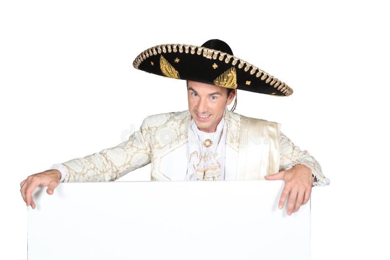 Man in a mariachi costume with a board left blank for your message. Man in a mariachi costume with a board left blank for your message