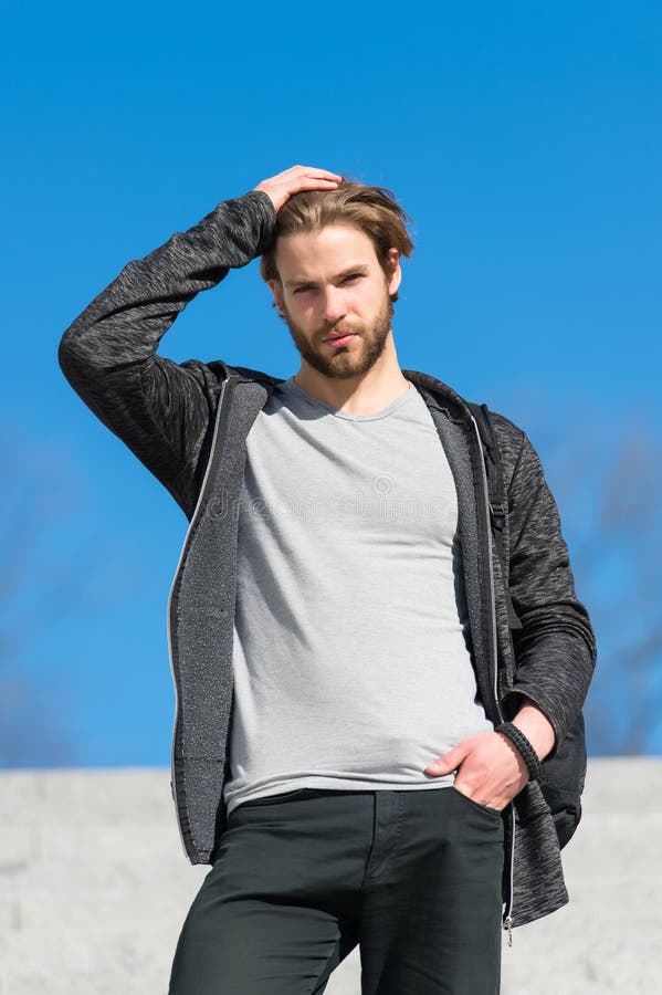 Mens Fashion and Style. Man with Beard in Casual Wear Touch Hair on Sunny Outdoor, Fashion. Macho Stand on Blue Sky, Perspective Stock Photo - Image of future, casual: 113576966 Mens Fashion and Style. Man with Beard in Casual Wear Touch Hair on Sunny Outdoor, Fashion. Macho Stand on Blue Sky, Perspective Stock Photo - Image of future, casual: 113576966