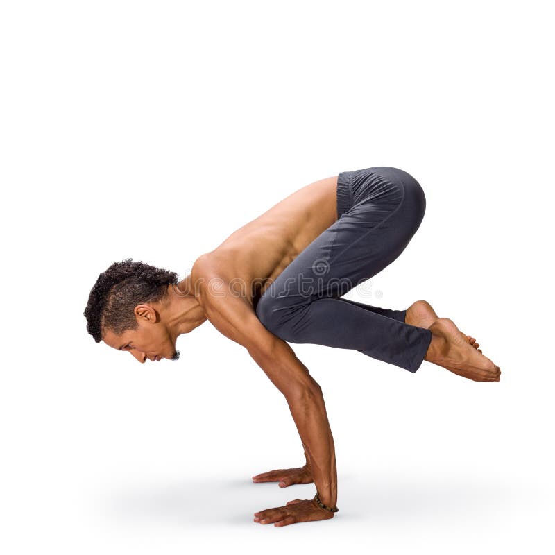 Mens het praktizeren de yougakraai stelt bakasana royalty-vrije stock foto's Mens het praktizeren de yougakraai stelt bakasana royalty-vrije stock foto's