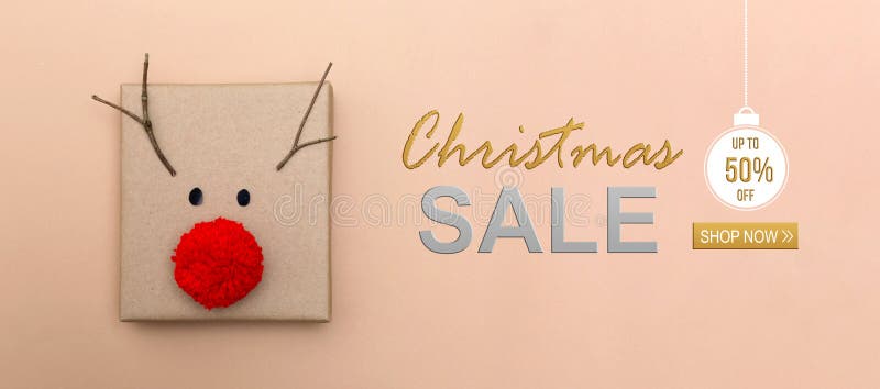 Mensagem de venda de Natal com uma caixa de presente de renas imagem de stock Mensagem de venda de Natal com uma caixa de presente de renas imagem de stock