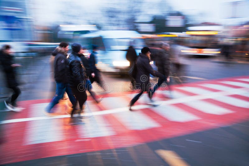 People on the move at a bus station. The picture was taken by panning the camera with long exposure. People on the move at a bus station. The picture was taken by panning the camera with long exposure