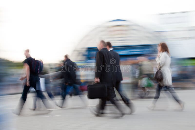 Motion blurred image of people rushing to work in the morning. Motion blurred image of people rushing to work in the morning