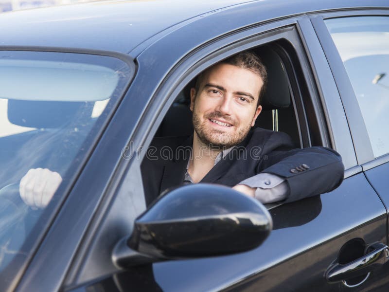 Man rijdt auto stock afbeeldingen