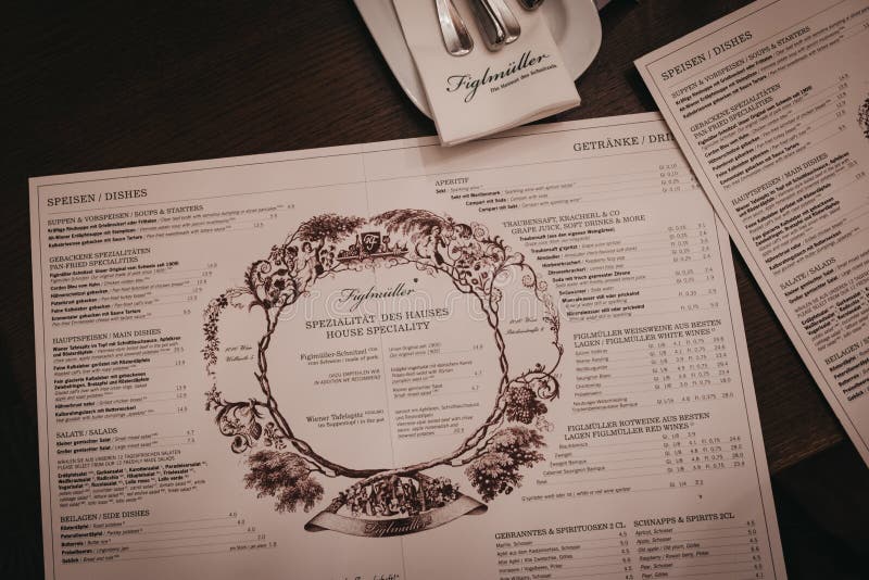 Vienna, Austria - Novermber 24, 2018: Menu on the table at Figlmuller on Wollzeile restaurant in Vienna. Opened in 1905, it is often referred to as the â€œHome of the Schnitzel. Vienna, Austria - Novermber 24, 2018: Menu on the table at Figlmuller on Wollzeile restaurant in Vienna. Opened in 1905, it is often referred to as the â€œHome of the Schnitzel