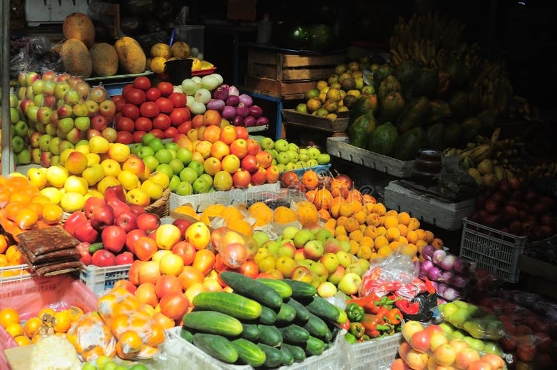 An outdoor fruit market, vegetables. An outdoor fruit market, vegetables