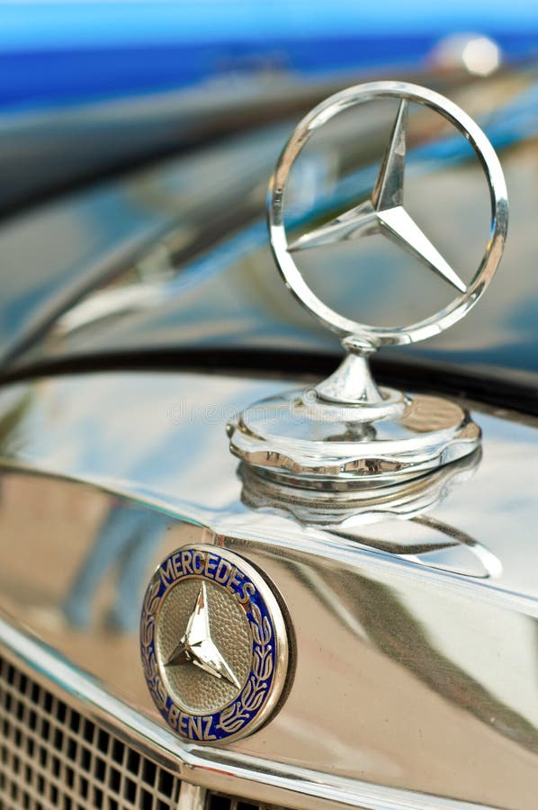 The Mercedes-Benz logo on a classic car