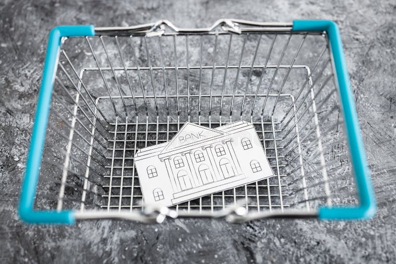 Merging and holdings, bank made of paper inside of shopping basket ready to be bought by a competitor royalty free stock images Merging and holdings, bank made of paper inside of shopping basket ready to be bought by a competitor royalty free stock images