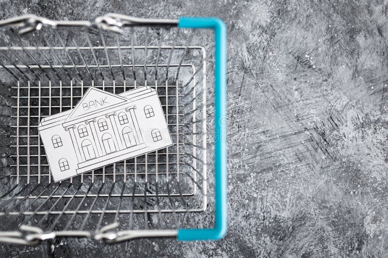 Merging and holdings, bank made of paper inside of shopping basket ready to be bought by a competitor stock photos Merging and holdings, bank made of paper inside of shopping basket ready to be bought by a competitor stock photos