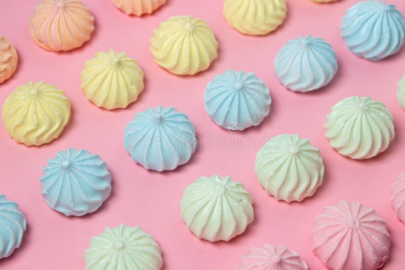 Meringue of different colors folded in several rows by color royalty free stock photo