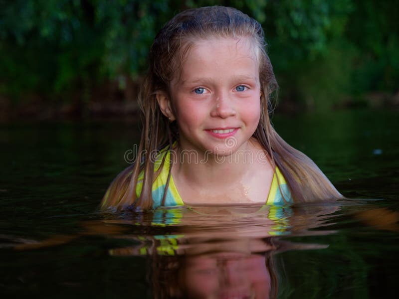 Mermaid Girls with Blue Eyes and Wet Hair in Dark Water Stock Photo ...