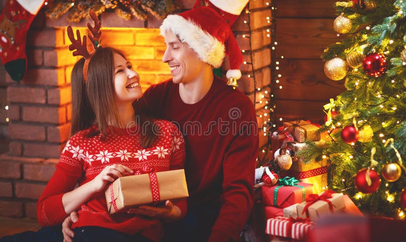 Merry Christmas! family couple with magic Christmas gift royalty free stock images Merry Christmas! family couple with magic Christmas gift royalty free stock images