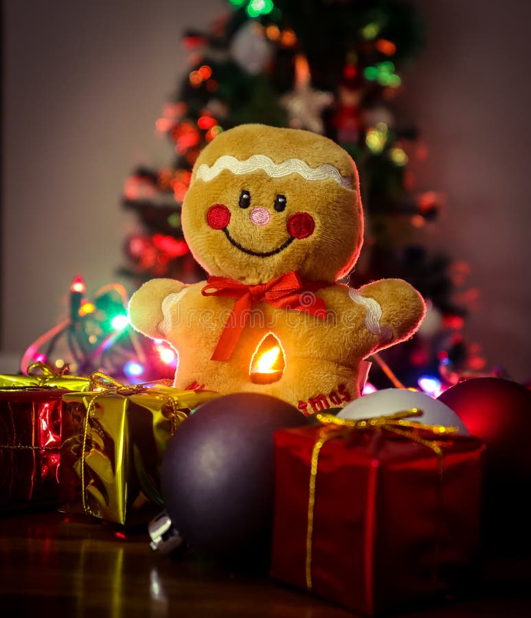 Merry Christmas Gingerbread Man with Decorations and Tree in Background Stock Photo Image of