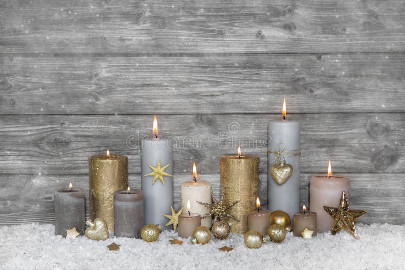 Merry christmas greeting card: wooden grey shabby chic background with candles.