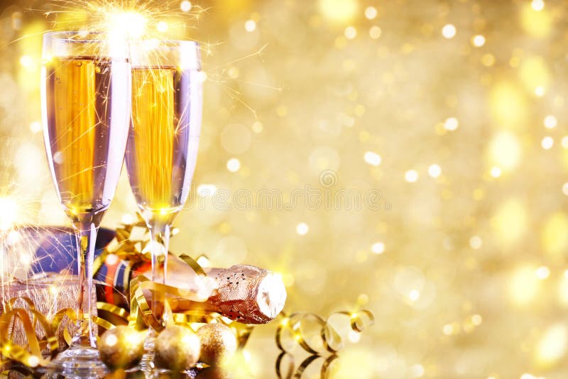 Merry Christmas and Happy New Year. A New Year`s background with New Year decorations and champagne. New Year`s card. Background with copy space. Merry Christmas and Happy New Year. A New Year`s background with New Year decorations and champagne. New Year`s card. Background with copy space.