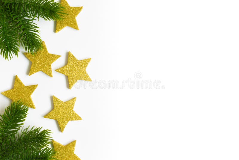 Merry christmas and Happy New Year card. Merry christmas and Happy New Year theme. Green spruce branches and golden stars on the left side of the white royalty free stock photography Merry christmas and Happy New Year card. Merry christmas and Happy New Year theme. Green spruce branches and golden stars on the left side of the white royalty free stock photography