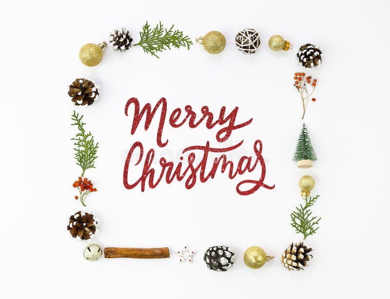 Merry Christmas red sparkles lettering sign framed by xmas decorations, golden balls, pinecones isolated on white royalty free stock image Merry Christmas red sparkles lettering sign framed by xmas decorations, golden balls, pinecones isolated on white royalty free stock image