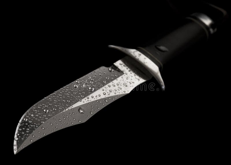 Knife with drops of water on the black backround. Knife with drops of water on the black backround