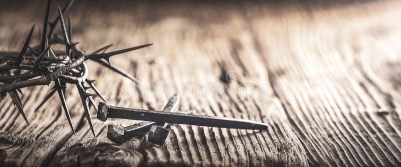 Three Crucifixion Spikes Wooden Table With Crown Of Thorns And Vintage Effect - Crucifixion And Resurrection Of Christ. Three Crucifixion Spikes Wooden Table With Crown Of Thorns And Vintage Effect - Crucifixion And Resurrection Of Christ