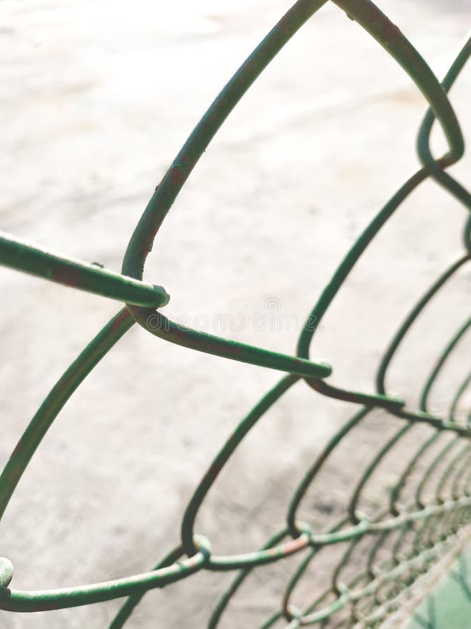 Mesh Chain Link Fence with Braided Metal Green Cells Stock Photo