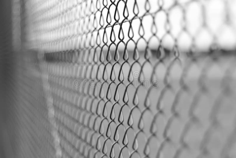 Mesh fence abstract background in black and white with shallow depth of field