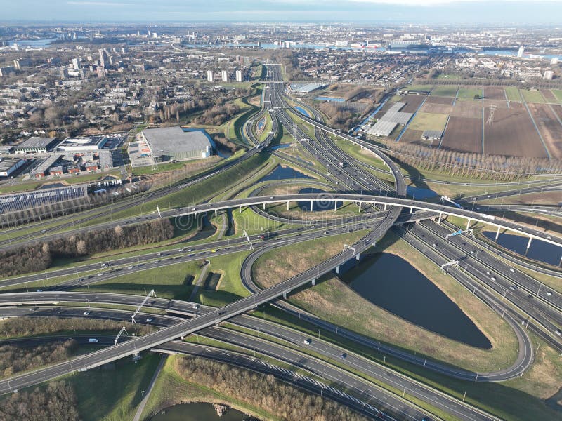 A mesmerizing aerial drone video of a bustling highway multilevel intersection captures the intricate web of roads and. This breathtaking drone footage showcases the complex design and engineering of a multilevel highway intersection.