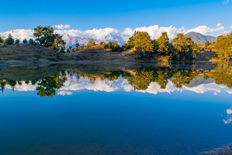 Mesmerizing reflection of Garhwal Himalayas in Deoria Tal or Lake. stock photography Mesmerizing reflection of Garhwal Himalayas in Deoria Tal or Lake. stock photography