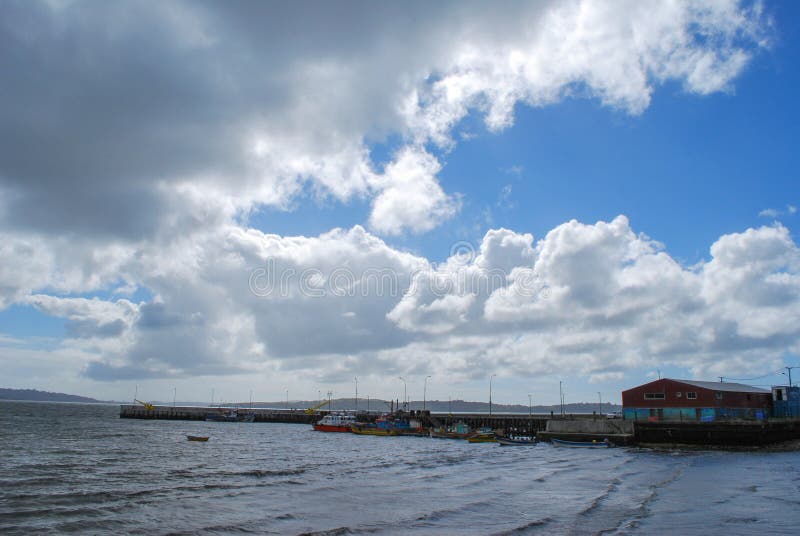 Mesmerizing scenery of city of Ancud coastal landscape under cloudy sky royalty free stock image