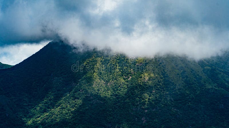 Mesmerizing scenery of foggy mountains stock images
