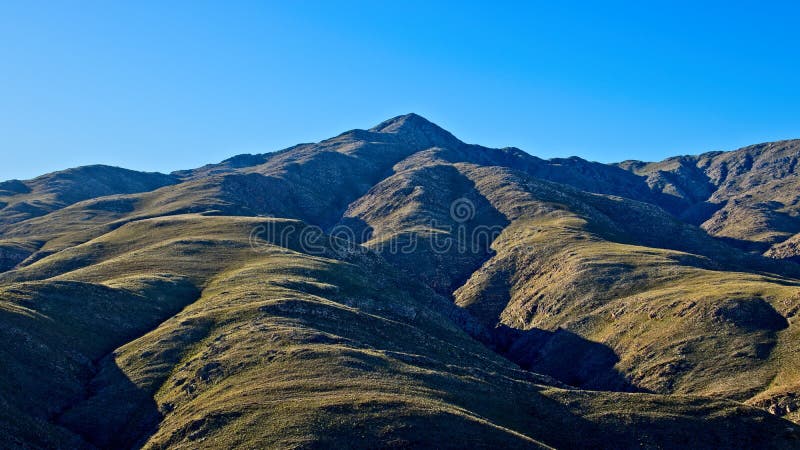 Mesmerizing scenery of hills touching the clear sky royalty free stock image