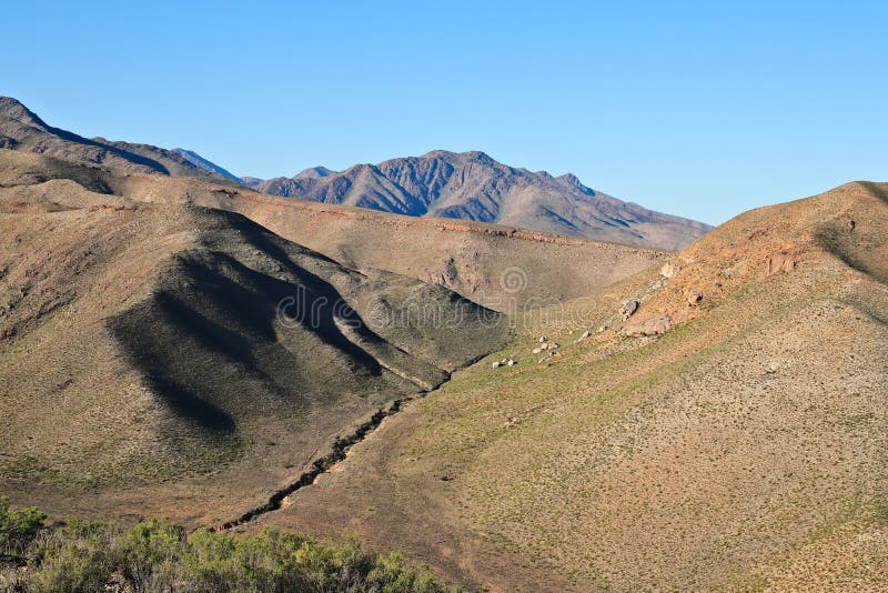 Mesmerizing scenery of hills touching the clear sky stock images