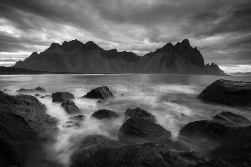 Mesmerizing scenery of a landscape during the sunset in grayscale stock photography