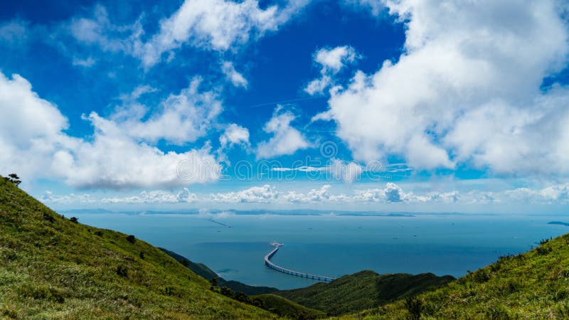 Mesmerizing scenery of mountains with blue lake in the background royalty free stock image