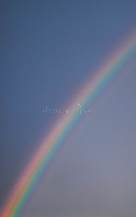 Mesmerizing scenery of the rainbow in the sky stock photo