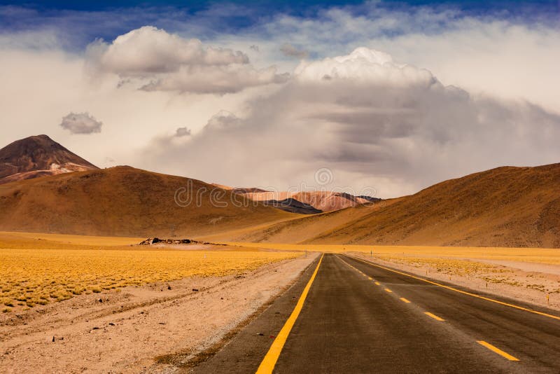 Mesmerizing scenery of a road in desert landscapes in Chile stock images