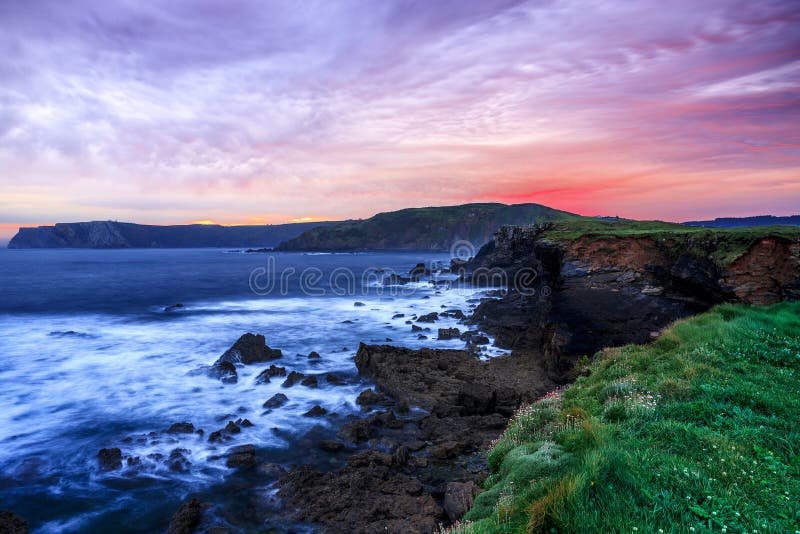 Mesmerizing scenery of a rocky shore during twilight-perfect wallpaper or background stock photo