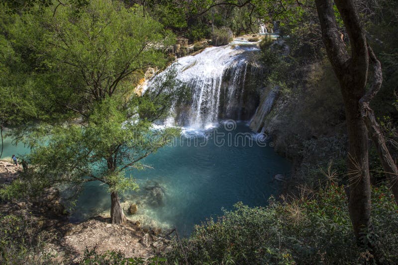 Mesmerizing scenery of a waterfall cascade in the forest stock photography