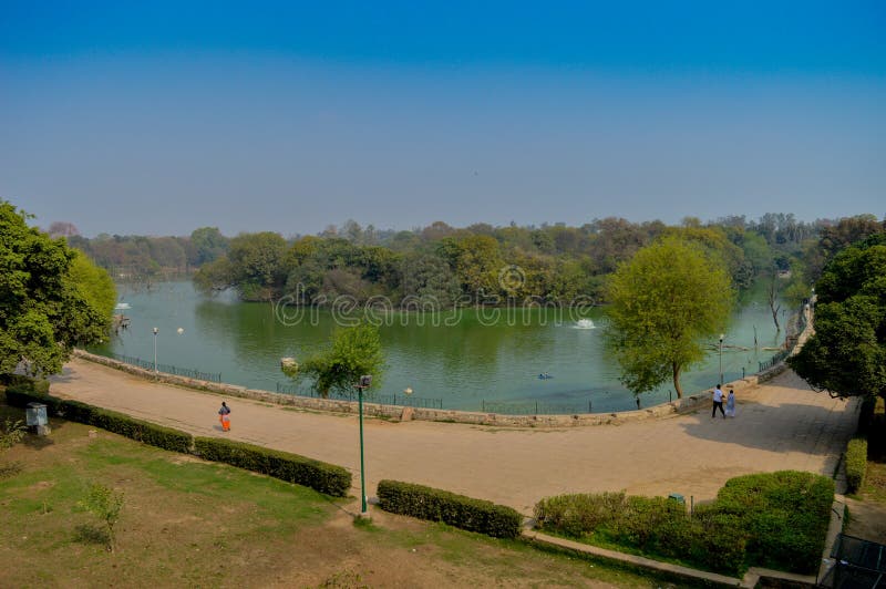 A mesmerizing view of hauz khas lake and garden from the hauz khas fort at hauz khas village at winter foggy morning