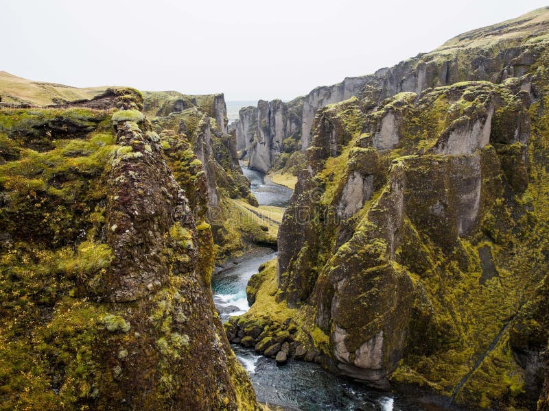 Mesmerizing view of the river flowing down the cliffs under the blue sky stock photos
