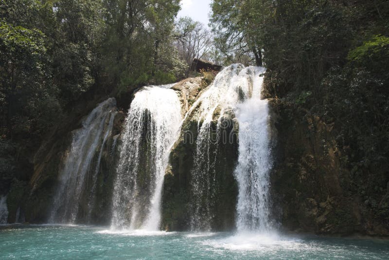 Mesmerizing view of the waterfall Cascada El Chiflon with the forest in the background stock photos