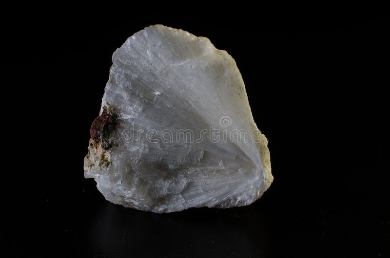 Mesolithic stone mineral on dark background stock photography