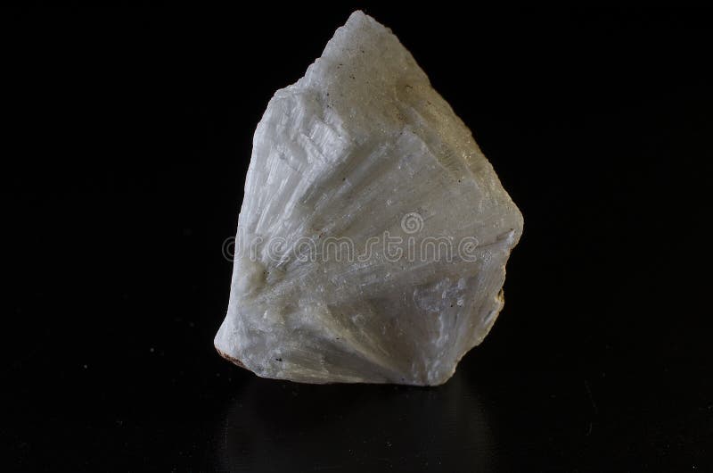 Mesolithic stone mineral on dark background stock images