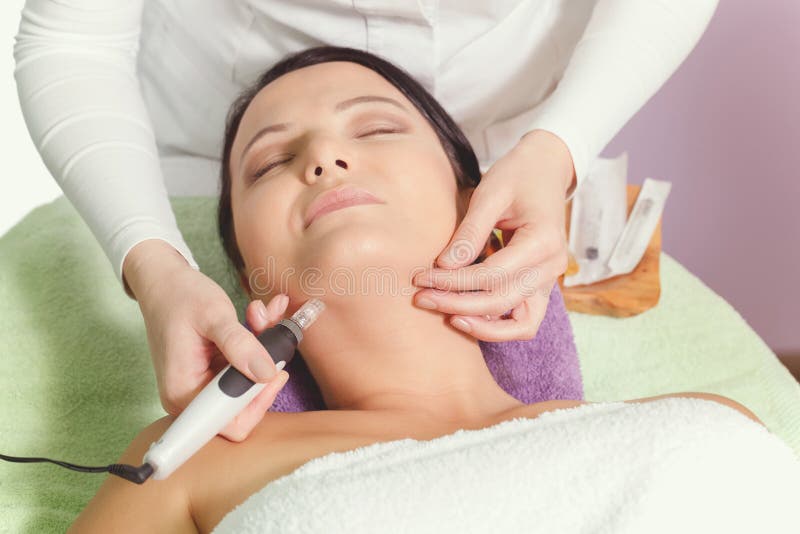 Woman having mesotherapy facial treatment at beauty salon, close up. Woman having mesotherapy facial treatment at beauty salon, close up